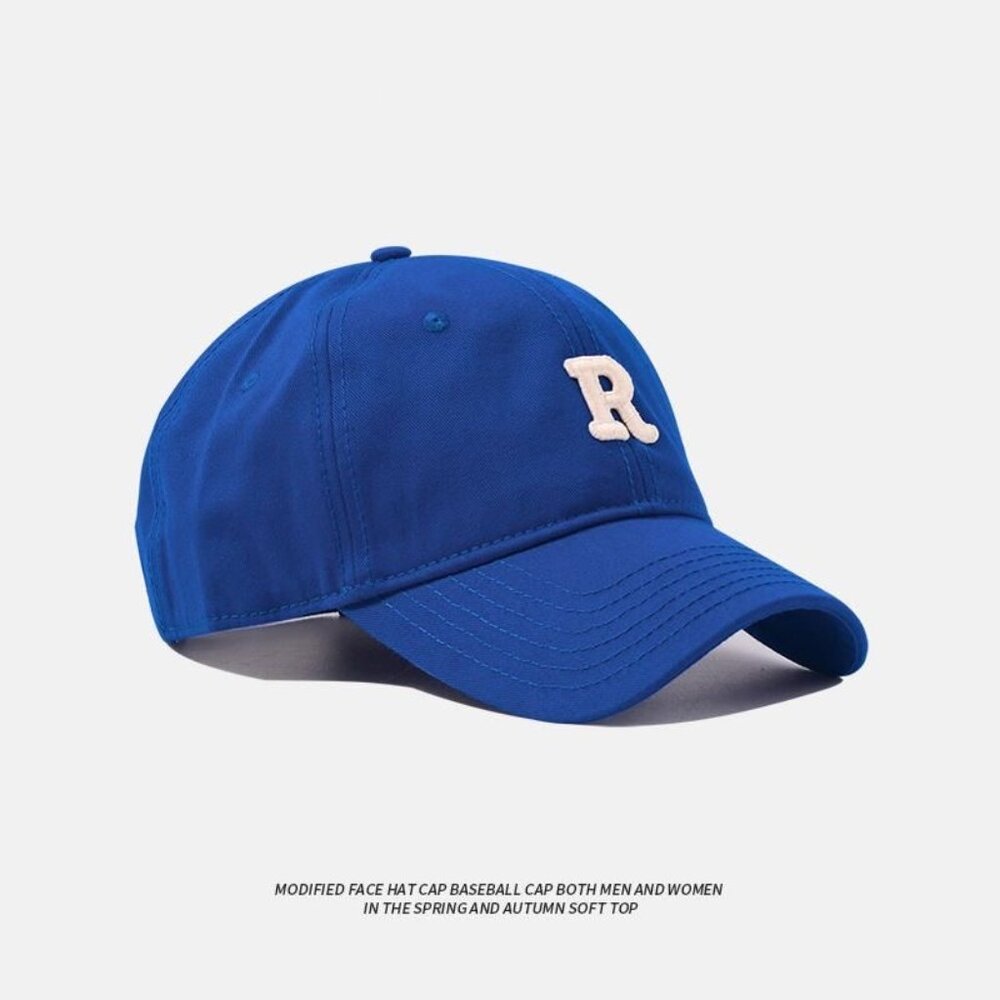 Girl in letter baseball cap